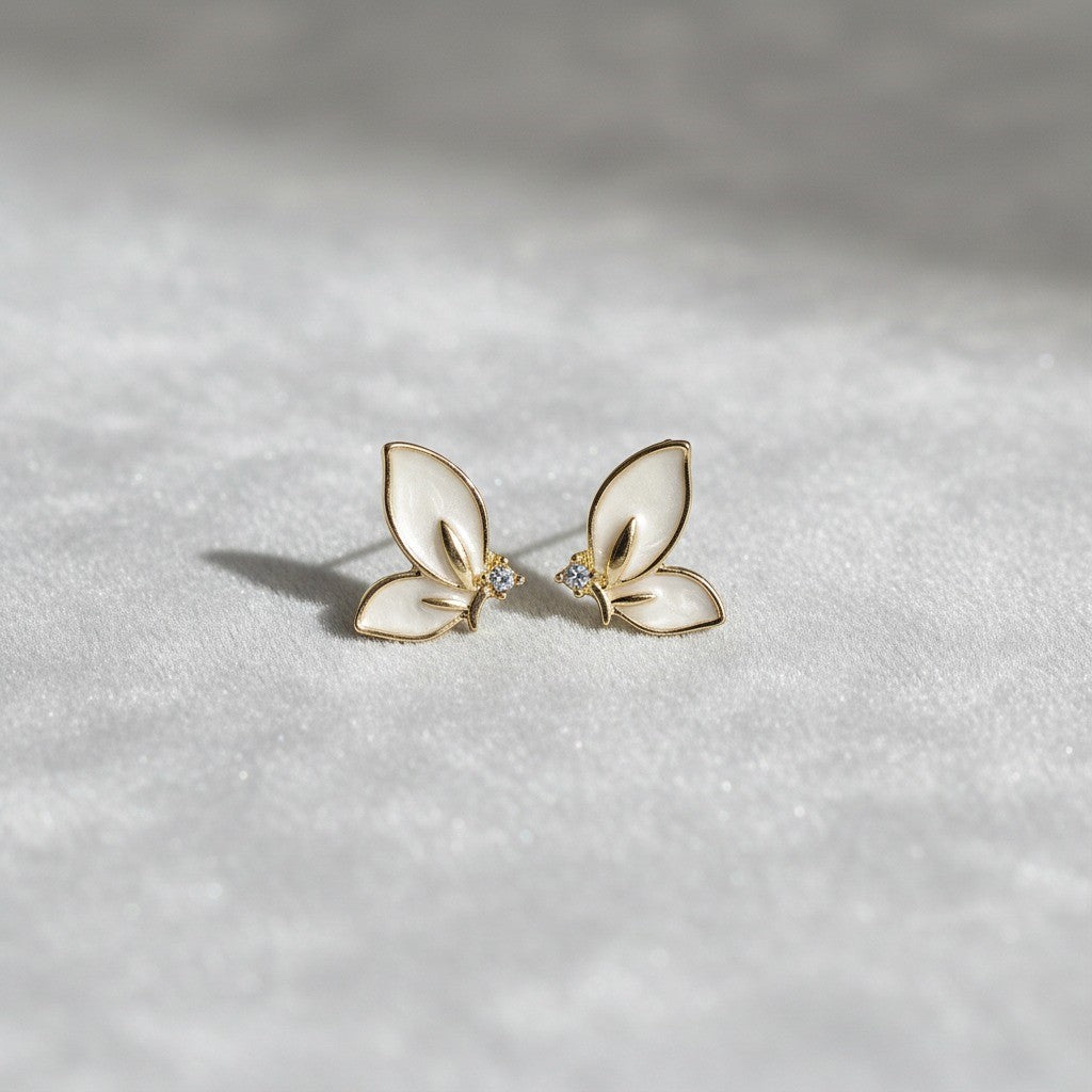 Elegant Butterfly Stud Earrings – Gold & White Enamel with Crystal Accent