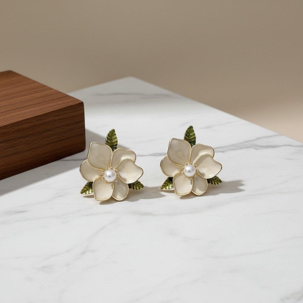 Elegant Floral Pearl Stud Earrings – White Enamel Flower with Green Leaf Accents