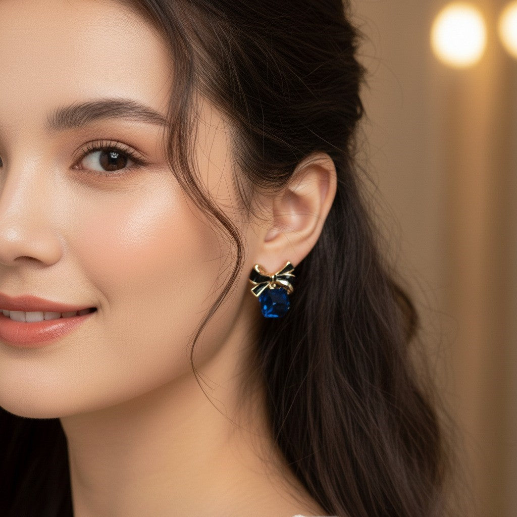 Elegant Bow & Blue Gemstone Stud Earrings – Chic Blue and Gold Accents